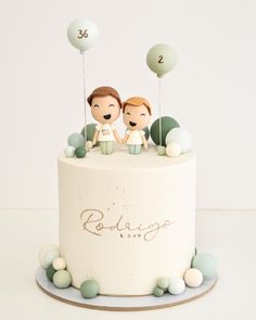 a wedding cake with two bride and groom figurines on top