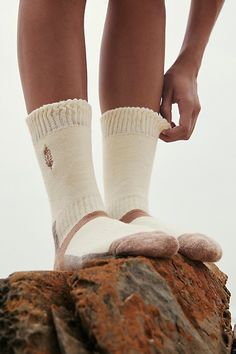 Just as fun as they are functional, these super cool socks are featured in a classic crew style with contrast detailing at bottom for both comfort and compression. **Features:** Crew style, ribbed knit top, buti logo embroidery, colorblocked design **Why We ❤ It:** The perfect pair for trekking the trail, these effortlessly essential socks are sure to be a staple in your hiking collection for many years to come. | Total Trek Hike Socks by FP Movement at Free People, Ivory Womans Socks, Essential Socks, Socks Photography, Socks Aesthetic, Outdoor Socks, Pin Design, Hiking Socks, Ribbed Knit Top, Sock Shop