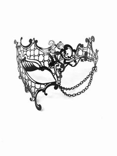 This mask is a work of art, featuring intricate laser-cut patterns that exude elegance and allure. Gracefully draped chains and rhinestones add a touch of glamour, ensuring you stand out at any masquerade event. Choose from classic black, elegant gold, or sleek silver to complement your outfit and personality.


Age Group/Gender - Adult/Women

Size/Type - One size fits all adults

Mask Color - Gold, silver, black

Mask Material - Laser cut metal

Special Features -  Chains and rhinestones Black Masquerade Mask Women, Masquerade Event, Kids Party Packs, Twt Layout, Masquerade Mask Women, Black Masquerade, Black Masquerade Mask, Oc Creator, Opera Mask