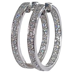 30mm Inside Out Estate Round Pave 3.0ctw Diamond 14k White Gold Hoop Earrings This great pair will make the perfect gift: 14k white gold Round inside-out diamond hoop earrings. Quality and timeless style. From our Estate Collection. Diamond hoop earrings are an on-trend alternative to the more conservative diamond stud earrings. While hoops offer a bit of boldness, the diamonds create a classic touch that allows the earrings to hold timeless versatility. You'll sparkle from all angles when you s Classic Platinum Hoop Earrings For Anniversary, Luxury Round Hoop Earrings With Brilliant Cut, Luxury Brilliant Cut Hoop Earrings, Luxury Round Brilliant Cut Hoop Earrings, Classic Platinum Hoop Earrings With Diamond Accents, Classic Channel Set Diamond White Hoop Earrings, Luxury Round Cubic Zirconia Hoop Earrings, Luxury Round Hoop Earrings With Cubic Zirconia, Luxury Vvs Clarity Hoop Diamond Earrings