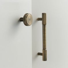 an open door with two knobs on each side and a handle to the left