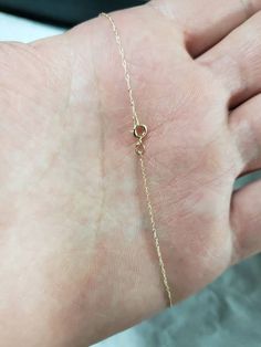 This is a 14kt gold 18 inch chain Solid 14kt gold 14Kt Stamp It is a dainty chain that is light and comfortable to wear every day. 0.39 Grams Weight 0.50mm width Comes in jewelry box 14k Gold-filled Delicate Chain Jewelry, Gold 14k Gold-filled Satellite Chain Bracelet, Delicate 14k Gold-filled Tarnish-resistant Chain Necklace, Fine Jewelry 14k Gold-filled Tarnish Resistant Chain Necklace, Delicate 14k Gold-filled Tarnish Resistant Chain Necklace, Gold Dainty Necklace, Real Gold Chains, Dainty Gold Necklace, Dainty Chain