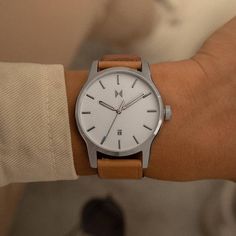 This MVMT by Movado men's watch is designed with a white dial and tan leather strap. Powered by quartz movement, this fine timepiece adds a touch of style to any look. Mvmt Watches Mens, Movado Mens Watches, Brown Leather Strap Watch, Brown Leather Watch, Hand Watch, Skeleton Hands, Leather Watch Strap, Eyewear Womens, White Dial