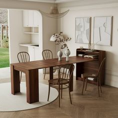 a dining room table and chairs in front of a sliding glass door