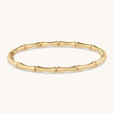 When you’re a nature girl at heart but a city girl by day, our Bamboo Bangle is your new go-to. The sleek gold design effortlessly blends natural elements with street chic. Pair it with our Bamboo Hoops to complete the look. Metal: 18k PVD gold plated over stainless steel Size: Adjustable Hypoallergenic Waterproof Tarnish-free Luxury Tarnish-resistant Bangle For Everyday, Elegant Polished Gold-plated Bangle, Elegant Ceremonial Gold-plated Bangle, Gold-tone Polished Finish Bangle For Gift, Bamboo Bangle, Bamboo Bracelet, Bangle Ring, Waterproof Jewelry, Nature Girl