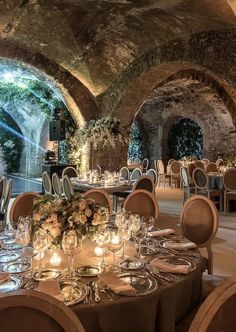 an indoor dining area with tables and chairs set up for formal function in the evening