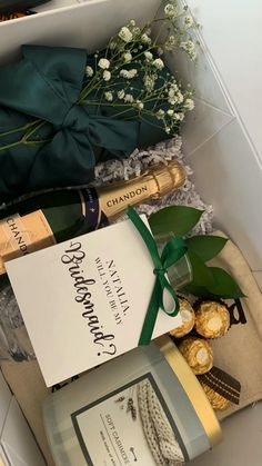 an open box containing champagne and other items