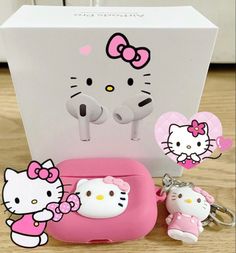 hello kitty keychain and other items are on the floor next to a box