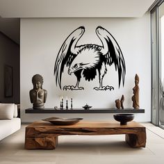 a living room filled with furniture and a large eagle wall decal on the wall