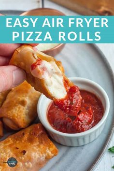 a person dipping sauce on pizza rolls with the words easy air fryer pizza rolls