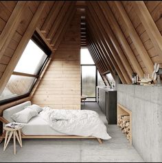 an attic bedroom with wooden walls and flooring