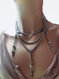 This handmade Edwardian style Festoon necklace had layered sections and beautiful spike drops. It is all stainless steel chain and a stunning modern grunge alt take on a classic necklace style. This choker is adjustable with a built-in extender from approximately 15" to 17",  All the chains and findings are made of sturdy stainless steel, ensuring durability and longevity, and making it completely hypoallergenic, waterproof, and non tarnish. It will look exactly like this forever!  This necklace set is an excellent handmade gift for someone special. It is a perfect choice for those who love alternative and goth styles, as well as anyone who wants to make a statement with their jewelry.. PLEASE NOTE FOR RETURNS! If I accept returns on your purchase (check when ordering, some items are "no r Gothic Stainless Steel Clavicle Chain Necklace, Punk Style Stainless Steel Jewelry For Party, Punk Stainless Steel Jewelry For Party, Punk Style Stainless Steel Party Jewelry, Gothic Metal Dangle Necklaces, Gothic Stainless Steel Necklace With Adjustable Chain, Layered Metal Choker Necklace, Punk Style Stainless Steel Clavicle Chain Jewelry, Metal Chain Dangle Choker