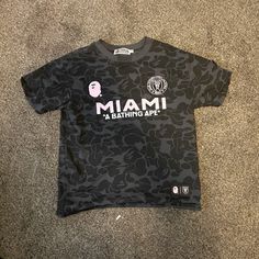 BAPE x Miami black and pink jersey ex bfs since this stank m cheated Bape Black, Bape Shirt, Jersey Pink, Pink Jersey, Bape Men, A Bathing Ape, Black And Pink, Jersey Tee, Miami