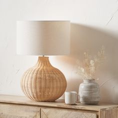 Charming Natural Woven Rattan Table Lamp – White Linen Shade & Textured Design - Decor interiors 1920s Design, Linen Lamp Shades, Rattan Table, Mahogany Wood, Linen Shades, White Linen, Lighting Collections, Touch Of Modern, Light Table