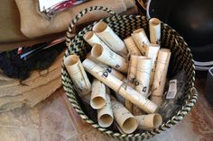 a basket full of rolled up toilet paper tubes