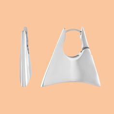 These striking earrings feature a distinctive geometric lock design, meticulously crafted in lustrous silver plating. The bold, angular shape creates a contemporary, architectural aesthetic, while the polished finish enhances the refined details of the geometric pattern. Each huggie is designed for a secure and comfortable fit, ensuring it stays elegantly in place. Perfect for adding a touch of modern flair to both everyday outfits and special occasions, embrace a refined edge with this exceptio Modern Pierced Hoop Earrings For Evening, Modern Sterling Silver Hoop Earrings For Evening, Modern Silver Hoop Earrings For Evening, Modern Silver Earrings With Shiny Finish, Modern Hoop Earrings For Evening, Modern Geometric Metal Hoop Earrings, Modern White Gold Earrings, Modern Hoop Earrings With Shiny Finish, Modern Hoop Earrings For Formal Occasions