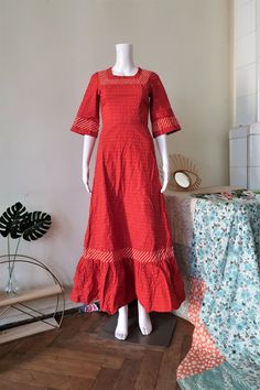 Beautiful True Vintage maxi dress from the 1970s. Fitted top, wide skirt. Made from a relatively heavy cotton fabric with dot print and striped trims. Square neck, wide sleeves, ruffle hem. Zipper in the back, unlined. Looks great with a pair of clogs and a wicker bag! BRAND: No brand label, it's custom-made ERA: 1970s COLOR: Red, white, yellow FABRIC: No fabric tag, it's cotton SIZE: No size tag, fits best a modern size XXS-XS - please check the measurements below for reference MEASUREMENTS: Pi Cotton A-line Maxi Dress With Ruffles, Red Fitted Cotton Maxi Dress, Red Maxi Length Cotton Dress, Fitted Red Cotton Maxi Dress, Cotton Maxi Dress With Ruffle Hem, Red Floor-length Cotton Maxi Dress, Red Vintage Cotton Maxi Dress, Red Maxi Dress With Ruffle Hem, Retro Cotton Prairie Dress With Ruffles