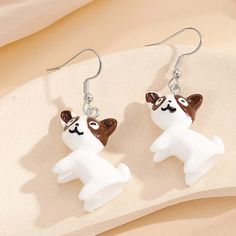 Add A Touch Of Playfulness To Your Outfit With These Brown & White Cartoon-Looking Dog Drop Earrings By Shein. These Earrings Feature A Cute Dog Design That Is Perfect For Any Occasion. The Silver Hooks Complement The White Main Stone Color And The Acrylic Material Gives Them A Light And Comfortable Feel. These Earrings Are Handmade With Care In China And Have A Length Of 1.25" (Not Including Hook). The Hook Closure Allows Them To Be Easily Worn On The Earlobe. Make A Statement With These Dangle White Cartoon, The Hook, Cute Dog, Acrylic Material, Dog Design, For Dogs, The White, Stone Color, Cute Dogs