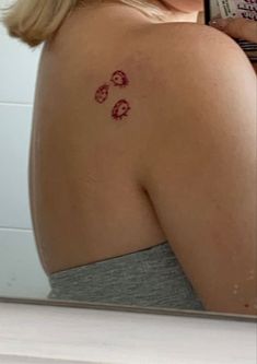 a woman with a small tattoo on her back