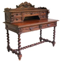 an old wooden desk with carved carvings on the top and bottom drawers, sitting against a white background