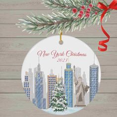 a christmas ornament with the statue of liberty in new york city on it