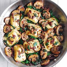 a pan filled with cooked mushrooms and spinach