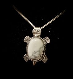 "* 925 Sterling Silver Turtle pendant necklace * 10mm x 14mm White buffalo, white turquoise, howlite stone * Handcrafted in the USA, made to order * slight variation in stone color will occur when compared to picture * Chain necklace available in sizes 16\",18\", or 20\" * Free shipping This beautiful Turtle pendant necklace is made entirely from 925 sterling silver with a Large white buffalo stone . The pendant has been measured, soldered, and set all by hand using quality materials here in the Spiritual Nickel-free White Jewelry, Nickel-free White Spiritual Jewelry, Spiritual White Nickel-free Jewelry, Handmade Adjustable White Turquoise Necklace, Sterling Silver White Cabochon Necklace, White Cabochon Sterling Silver Necklace, Handmade Howlite Spiritual Jewelry, Handmade Spiritual Howlite Jewelry, Nickel-free White Oval Pendant Necklace