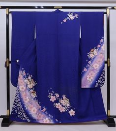 This striking silk Furisode Kimono is covered in floral on a royal blue background.  A vintage Japanese long sleeved dress with extra long length for trailing on the ground when you walk. Wear this Kimono dress for your special event, or hang  it as a display to enjoy everyday. Item: Furisode Silk Kimono No. frn198 Size: US  M-L   /  Length 64.9 inches (165cm), Width 26.7 inch (68cm). Condition: Used, Vintage, Good. Please check the photos. Need a KIMONO RACK to hang this kimono?  Find it here: Elegant Blue Floral Print Kimono, Traditional Blue Floral Print Kimono, Traditional Blue Kimono For Tea Ceremony, Traditional Blue Floral Kimono, Blue Silk Kimono For Wedding, Floral Print Long Sleeve Kimono For Wedding, Blue Silk Wedding Kimono, Long Sleeve Floral Print Kimono For Wedding, Long Sleeve Floral Kimono For Wedding