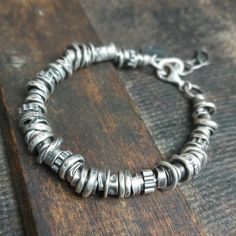 "Handmade unisex oxidized sterling silver bracelet with beads (6-10 mm). It is available with either raw or polished finish - the photo shows a polished bracelet. We offer bracelets in many sizes: 6\" (15 cm), 6.5\" (16,5 cm), 7\" (18cm), 7.5\" (19 cm), 8\" (20,5 cm) 8.5\" (21.5 cm), 9\" (22.5 cm).  Choose the one that is most similar for your wrist circumference and share your actual wrist circumference in the note to your order. This way we can perfectly adjust the size of your bracelet. We send jewelry in an elegant box. Thanks for visiting Treendystudio!" Everyday Hand Wrapped Silver Bracelets, Sterling Silver Oxidized Fusion Bracelets, Oxidized Sterling Silver Fusion Bracelet, Sterling Silver Fusion Bracelet With Silver Beads, Minimalist Oxidized Bracelets For Everyday, Sterling Silver Bracelet With Oxidized Finish For Everyday, Everyday Sterling Silver Bracelet With Oxidized Finish, Everyday Minimalist Oxidized Bracelets, Artisan Silver Bracelet With Oxidized Finish