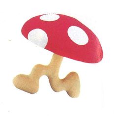 a red mushroom with white dots on it's head is shown against a white background