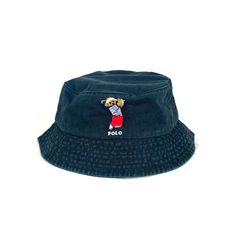 Vintage Black/Beige/Navy/White Polo Bear Golfing Bear Bucket Hat Iconic embroidered Golfing Polo Bear 🧸 Diameter of the inside of the hat is roughly 22-24in varying slightly with each hat One size fits all, perfect for festivals, raves or any event where you need to look like a baller Free Shipping Included with every purchase No returns on sizing issues Casual Adjustable Sun Hat With Embroidered Logo, Casual Wide Brim Bucket Hat With Embroidered Logo, Casual Wide Brim Hat With Embroidered Logo, Casual Bucket Hat With Embroidered Logo And Flat Brim, Casual Bucket Hat With Embroidered Logo And Short Brim, Casual Bucket Hat With Embroidered Logo, Casual Vacation Hats With Embroidered Logo, Embroidered Logo Beach Visor Hat, Casual Beach Hat With Embroidered Logo