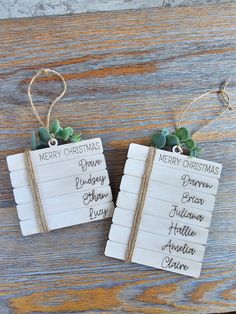 two wooden tags with christmas names on them