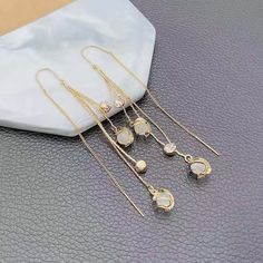 Material: Zircon Style: Simple Color: Ear Studs, Hanging Earrings Fashion Element: Chain, Geometry White Dangle Alloy Earrings, White Alloy Dangle Earrings, Dangle Crystal Alloy Earrings, Dangle Alloy Earrings With Ear Wire, Alloy Drop Earrings With Ear Wire, Needle Earrings, Hanging Earrings, Simple Colors, Ear Studs