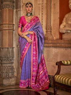 This stunning saree features a beautiful zari patola print work on a luxurious purple silk fabric, making it the perfect choice for weddings, festivals, and other special occasions.
The saree comes with a matching pink silk blouse with patola print work, adding a pop of color to the overall look. The 5.50 meters saree and unstitched blouse material allow for customization to ensure the perfect fit for any body type.
This saree includes its intricate patola print work, which adds a traditional to Traditional Purple Pre-draped Saree For Navratri, Purple Art Silk Pre-draped Saree For Navratri, Festive Purple Tussar Silk Pre-draped Saree, Purple Self-design Pre-draped Saree For Puja, Purple Katan Silk Pre-draped Saree With Zari Work, Purple Dola Silk Pre-draped Saree With Self Design, Purple Art Silk Pre-draped Saree With Self Design, Traditional Purple Pre-draped Saree For Puja, Purple Pre-draped Saree For Puja