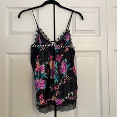 Size Medium Victoria’s Secret Sexy Silky With Lace Trim. Flower Print. Never Worn Floral Print Cami Sleepwear For Loungewear, Floral Print Camisole Sleepwear, Black Tops For Pajama Party In Spring, Black Camisole Sleepwear For Spring, Sleeveless Floral Print Sleep Top, Sleeveless Floral Print Top For Sleep, Black Floral Print Spaghetti Strap Tops, Victoria's Secret Floral Print Sleepwear For Pajama Party, Flower Night