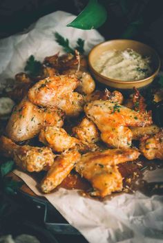 chicken wings with dipping sauce on the side