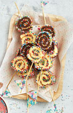 several donuts with sprinkles are on a plate and ready to be eaten