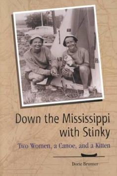 two men sitting next to each other in front of a wooden sign with the words down the mississippi with stinky