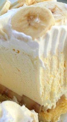 a banana cream pie with whipped cream and sliced bananas on top, ready to be eaten