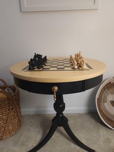 a chess board on top of a table next to baskets and wicker basketes