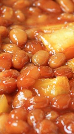 baked beans and pineapples are in a sauce