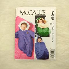 a child's sleeping bag with hood and sleeves