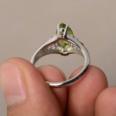 This is a gorgeous handmade creation. Its beauty is its simplicity & Elegance. The 6*12 mm marquise shape faceted natural Peridot is crafted in solid sterling silver and with rhodium plated. Main stone weight about 1.9 ct. All item is sent in a beautiful gift box If you have any idea of design your ring,pls contact me directly. You can realize more lovely stuff clicking the link https://www.etsy.com/shop/knightjewelry?refshopsection_shophome_leftnav Please leave the correct address and you p Fine Jewelry Birthstone Rings In Marquise Cut, Fine Jewelry Marquise Cut Birthstone Rings, Marquise Diamond Birthstone Ring With Gemstone, Marquise Cut Ring With Prong Setting For May Birthstone, Marquise Emerald Ring With Center Stone, Fine Jewelry Marquise May Birthstone Ring, Marquise Cut Diamond Ring For May Birthstone, Marquise Cut Diamond Birthstone Ring, White Gold Marquise Gemstone Ring