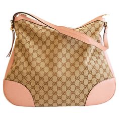 An authentic Gucci Bree shoulder bag/hobo bag. The bag features a GG canvas exterior, pink leather trim, and light-gold-toned hardware. The interior is lined with beige fabric and there are three side pockets, one zipped pocket, and two slip pockets. The interior is neat & clean. The exterior, trim, and hardware are in excellent condition with no notable flaws to be mentioned. Overall the bag is in very good pre-loved condition and comes with its Gucci dust bag and cards. Gucci Shoulder Bag With Leather Handles And Coated Canvas, Lined Interior Satchel Bag, Gucci Canvas Shoulder Bag For Everyday Use, Gucci Leather Handle Satchel Shoulder Bag, Gucci Leather Crossbody Bag With Leather Handles, Gucci Canvas Top Handle Shoulder Bag, Gucci Leather Satchel Shoulder Bag, Beige Shoulder Bag For Travel With Lined Interior, Gucci Monogram Canvas Shoulder Bag With Leather Handles