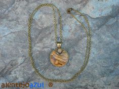 "Lovely bronze pendant medallion with a handmade cabochon Ø 25 mm - 0.98 inches in fine olive wood with a 75 cm - 29.5 inches long bronze plated chain or an adjustable leather cord 1 meter ( 39.37 \" ) naturally the grain of the olive wood can vary from item to item , but in any case you will get a pendant with an olive wood cabochon with beautiful grain handcrafted by us in Portugal the olive wood is finely sanded and oiled with olive oil" Bohemian Natural Wood Necklaces As Gift, Bohemian Natural Wood Necklace As Gift, Bohemian Natural Wood Jewelry As Gift, Bohemian Natural Wood Jewelry Gift, Rustic Round Necklace For Gift, Handmade Round Natural Wood Jewelry, Cork Necklace, Wood Moon, Christmas Gift Items