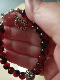 This Vampire Blood Red Gothic Bracelet and Earrings set adorned with elaborate Filigree Beads in a antique finish for added drama with also Blood Red Glass Beads. The Bracelet features a bold, statement making design, while the Earrings add a touch of elegance to any outfit perfect accessory to channel your inner Goth chicory pair it down for everyday wear. Made to order for Size. Red Metal Beaded Bracelet With Round Beads, Blood Accessories, Vintage Red Jewelry With 8mm Beads, Vintage Red 8mm Beaded Jewelry, Red Beaded Bracelets For Halloween Gift, Vampire Bracelet, Vampire Accessories, Red Gothic, Gothic Bracelet