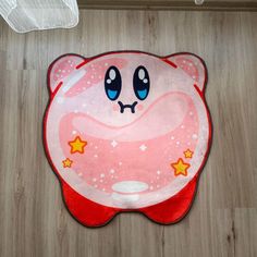 a pink rug with an image of a cartoon character on it