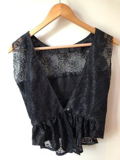 Vintage Black Lace Sleeveless & Backless Blouse Cheap Sleeveless Lace Trim Blouse, Black Sleeveless Corset With Lace Top, Black Sleeveless Lace Top Corset, Sleeveless Lace Top With Lace Trim For Evening, Vintage Black Lace Corset, Vintage Sleeveless Evening Corset, Vintage Sleeveless Evening Top, Vintage Lace V-neck Top, Vintage Lace Trim Corset For Party