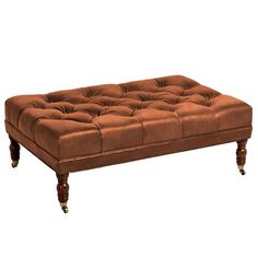 a brown leather bench with wooden legs on an isolated white background for use in interior and exterior design