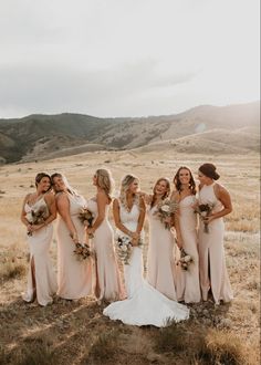 a group of women standing next to each other in a field